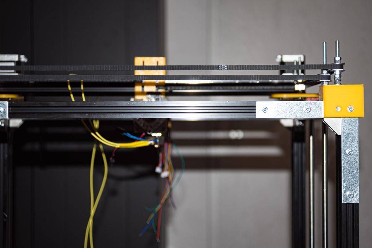 Photo depicting build process and custom designed mounts and axis components.